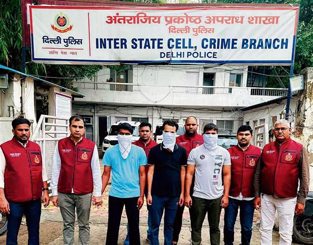 The accused with Crime Branch personnel in New Delhi on Tuesday.