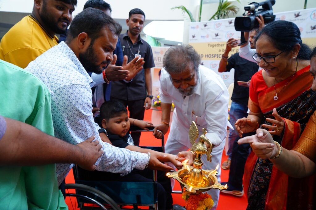 This image has an empty alt attribute; its file name is Shri-C.-DAMODARA-RAJANARASIMHA-seen-lighting-the-lamp-to-mark-the-inauguration-of-the-celebrations-1024x682.jpeg